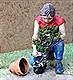 CF110 - Gardener planting a bush